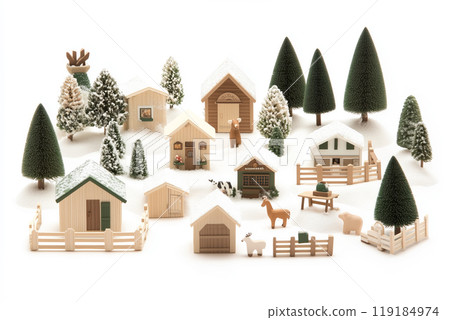 Miniature winter village with various houses, trees, and figurines on a white snowy background. Festive holiday decor 119184974