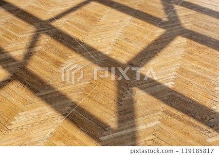 Abstract background with straight shadows on old wooden parquet. 119185817