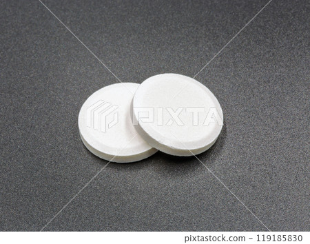 Effervescent tablet pills closeup on black. Effervescent tablet pills closeup on black. 119185830