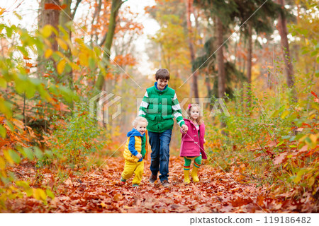 Kids playing in autumn park Kids playing in autumn park 119186482