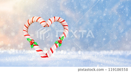 Merry Christmas. Candy cane and gifts in snow 119186558