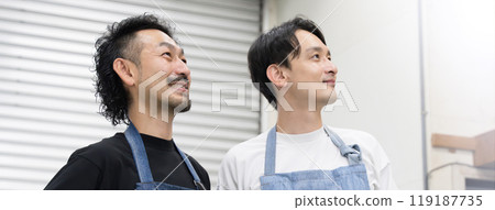 A profile of a salesperson (clerk) or craftsman at a recycling store looking up A profile of a salesperson (clerk) or craftsman at a recycling store looking up 119187735