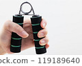 Woman's hand holding a hand grip 119189640