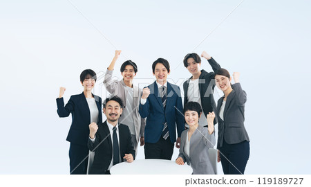 A group of business people of a wide range of generations doing a guts pose A group of business people of a wide range of generations doing a guts pose 119189727