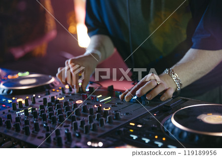 Close up view of a dj's hands 119189956