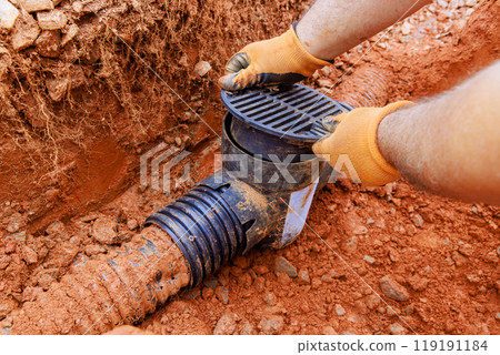 Damaged drainage system for collecting rainwater requires replacement of underground storm sewer pipes. Damaged drainage system for collecting rainwater requires replacement of underground storm sewer pipes. 119191184