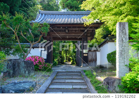 A temple gate with blooming azalea flowers in Kyoto A temple gate with blooming azalea flowers in Kyoto 119192202