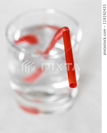 Plastic tube in a glass 119192433