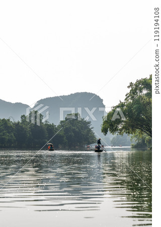 Tourist boat on the river at Trang An, Vietnam. Tourist boat on the river at Trang An, Vietnam. 119194108