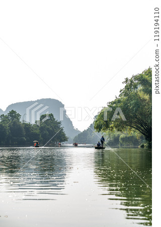 Tourist boat on the river at Trang An, Vietnam. 119194110
