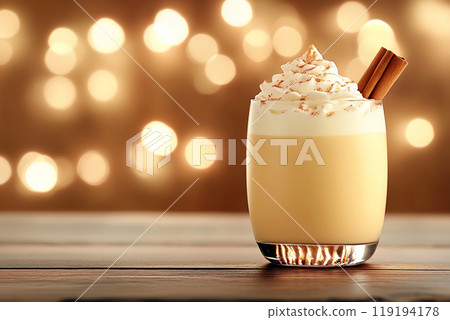 Creamy drink eggnog with whipped cream, cinnamon, and festive bokeh background, ideal for Christmas holiday celebrations 119194178
