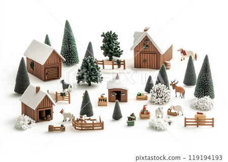 Miniature winter village with various houses, trees, and figurines on a white snowy background. Festive holiday decor 119194193