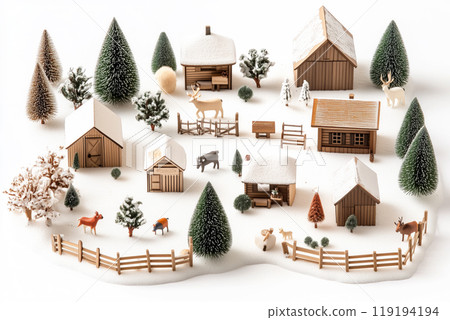 Miniature winter village with various houses, trees, and figurines on a white snowy background. Festive holiday decor 119194194
