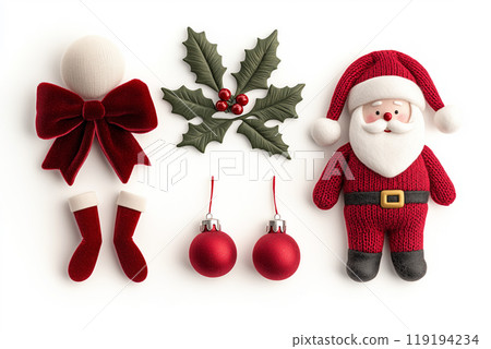 A variety of festive ornaments, pinecones, Santa Claus toy and foliage on white background, Christmas Tree Decorations 119194234