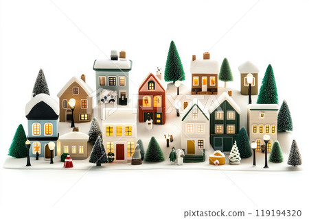 Miniature winter village with various houses, trees, and figurines on a white snowy background. Festive holiday decor 119194320
