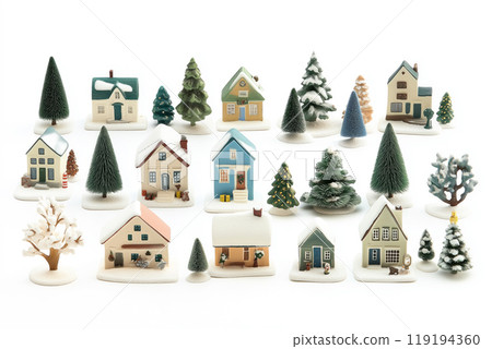 Miniature winter village with various houses, trees, and figurines on a white snowy background. Festive holiday decor 119194360