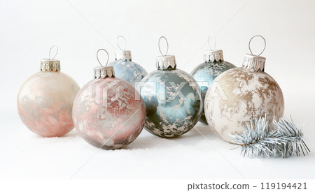 Beautiful Christmas ornaments with intricate gold and white designs on white background. Concept of holiday decoration Beautiful Christmas ornaments with intricate gold and white designs on white background. Concept of holiday decoration 119194421