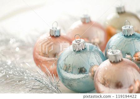 Beautiful Christmas ornaments with intricate gold and white designs on white background. Concept of holiday decoration Beautiful Christmas ornaments with intricate gold and white designs on white background. Concept of holiday decoration 119194422