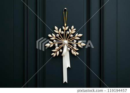 A beautifully crafted ornamental snowflake featuring leaves and silver bells, door hanger on black background A beautifully crafted ornamental snowflake featuring leaves and silver bells, door hanger on black background 119194457