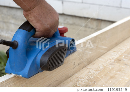 Worker is planing boards Worker is planing boards 119195249