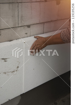 builder installs polystyrene foam sheets builder installs polystyrene foam sheets 119195256