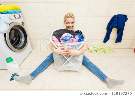 Woman with big basket of dirty clothes laundry. Woman with big basket of dirty clothes laundry. 119197270