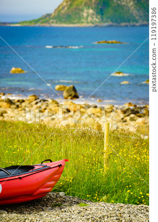 Sea coast with red canoe on shore Andoya Norway 119197386