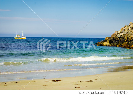 Seascape with fishing boat and stone breakwater Seascape with fishing boat and stone breakwater 119197401