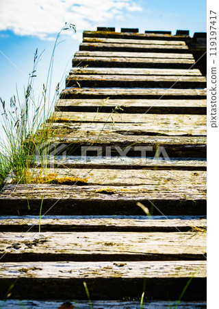 Old wooden stairway to sky. Old wooden stairway to sky. 119197417