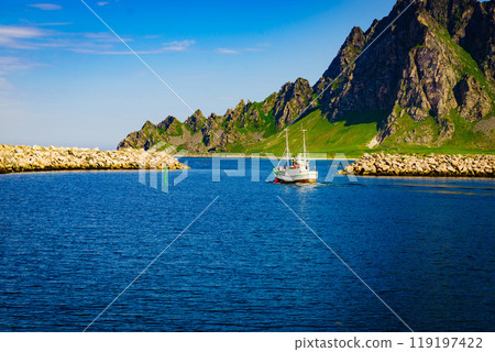 Seascape with fishing boat and stone breakwater Seascape with fishing boat and stone breakwater 119197422