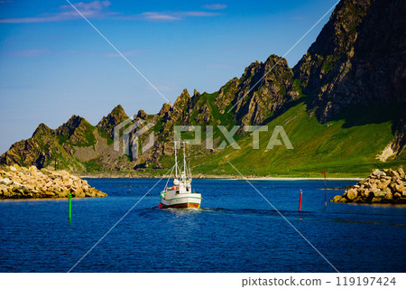 Seascape with fishing boat and stone breakwater Seascape with fishing boat and stone breakwater 119197424