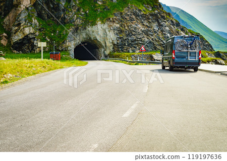 Road with old tunnel in mountains Norway 119197636