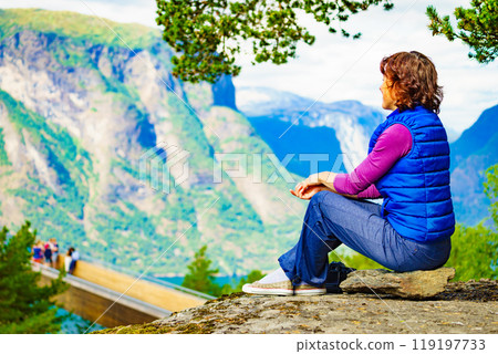Tourist enjoying mountains fjord view, Norway 119197733