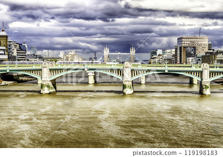 London cityscape with Tower Bridge over Southwark Bridge, UK 119198183
