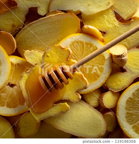 Honey with fresh ginger and lemon slices. Honey with fresh ginger and lemon slices. 119198308