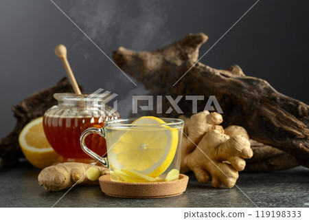 Ginger tea with lemon and honey. 119198333