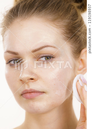 Girl removes mask cosmetic Girl removes mask cosmetic 119198937