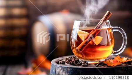 Steaming Hot Apple Cider with Cinnamon Sticks in a Glass Mug 119199218