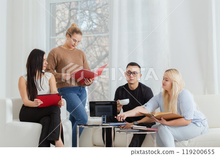 A group of people are sitting on a sofa and discussing work issues 119200655