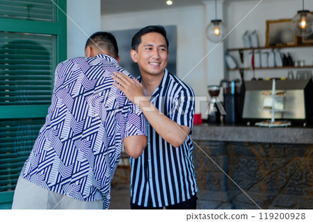 A Warm Welcome Shared Among Friends in a Trendy Modern Cafe Environment A Warm Welcome Shared Among Friends in a Trendy Modern Cafe Environment 119200928