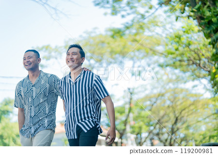 Joyful Moment Two Friends Enjoying a Pleasant Walk Together in Beautiful Nature 119200981