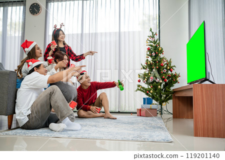 group asian friends watching television christmas 119201140