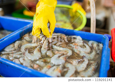 Explore Fresh Shrimp at the Seafood Market, carefully handled to ensure quality 119201141