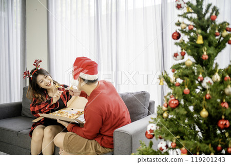 happy couple spending christmas day together 119201243