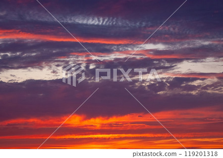 A beautiful sunset with a purple sky and clouds 119201318