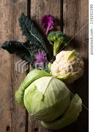 Broccoli, cauliflower and kale on a old wooden table. 119201590
