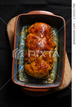 Baked meat dishes, chicken breast, stuffed meatloaf in a baking dish 119201780