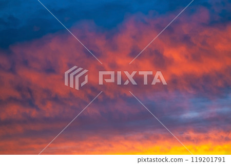 A beautiful sunset with pink clouds on a dark blue sky A beautiful sunset with pink clouds on a dark blue sky 119201791