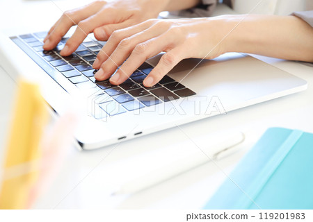 Hands working on a computer Business scene 119201983