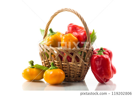 ripe red and yellow sweet peppers. 119202806